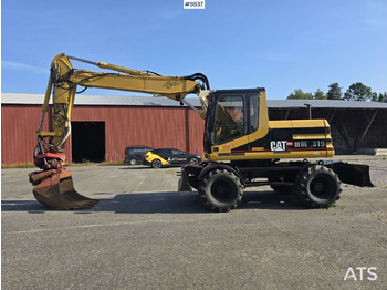 Колесен багер CATERPILLAR M315