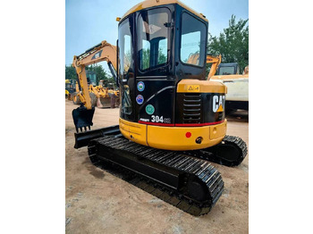 Мини багер CATERPILLAR