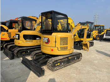 Мини багер CATERPILLAR