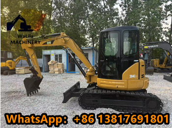 Мини багер CATERPILLAR