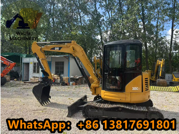 Мини багер CATERPILLAR