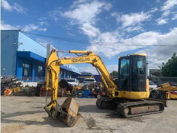 Мини багер NEW HOLLAND