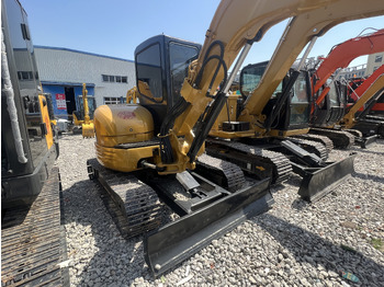 Мини багер CATERPILLAR