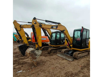 Мини багер CATERPILLAR