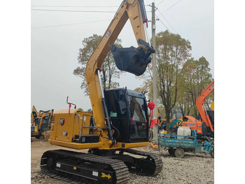 Мини багер CATERPILLAR
