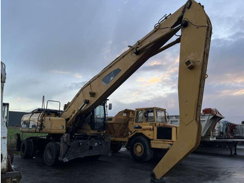 Багер за манипулиране на материали CATERPILLAR