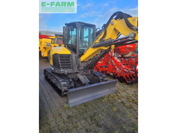 Мини багер NEW HOLLAND