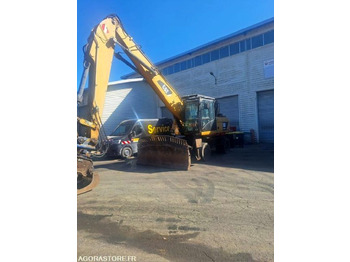 Багер CATERPILLAR M318D