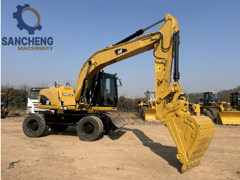 Колесен багер CATERPILLAR M320