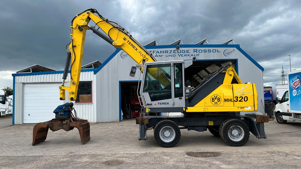 Fuchs TeRex MHL 320 D Umschlagbagger Greifer Pratzen - Багер за манипулиране на материали: снимка 1 Fuchs TeRex MHL 320 D Umschlagbagger Greifer Pratzen - Багер за манипулиране на материали: снимка 1