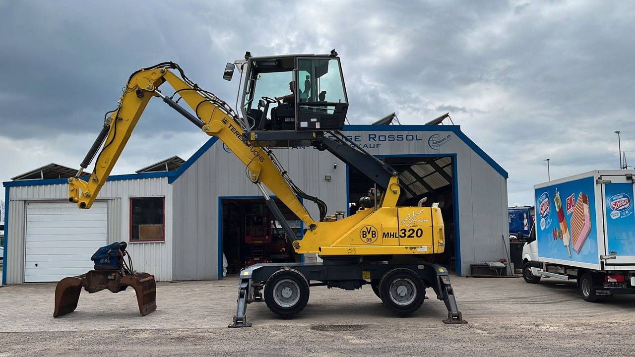 Fuchs TeRex MHL 320 D Umschlagbagger Greifer Pratzen - Багер за манипулиране на материали: снимка 2 Fuchs TeRex MHL 320 D Umschlagbagger Greifer Pratzen - Багер за манипулиране на материали: снимка 2