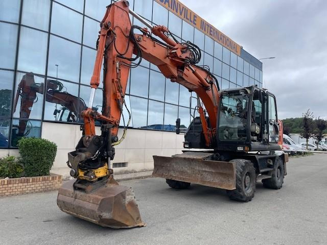 Hitachi ZX140W-5B - Колесен багер: снимка 1 Hitachi ZX140W-5B - Колесен багер: снимка 1