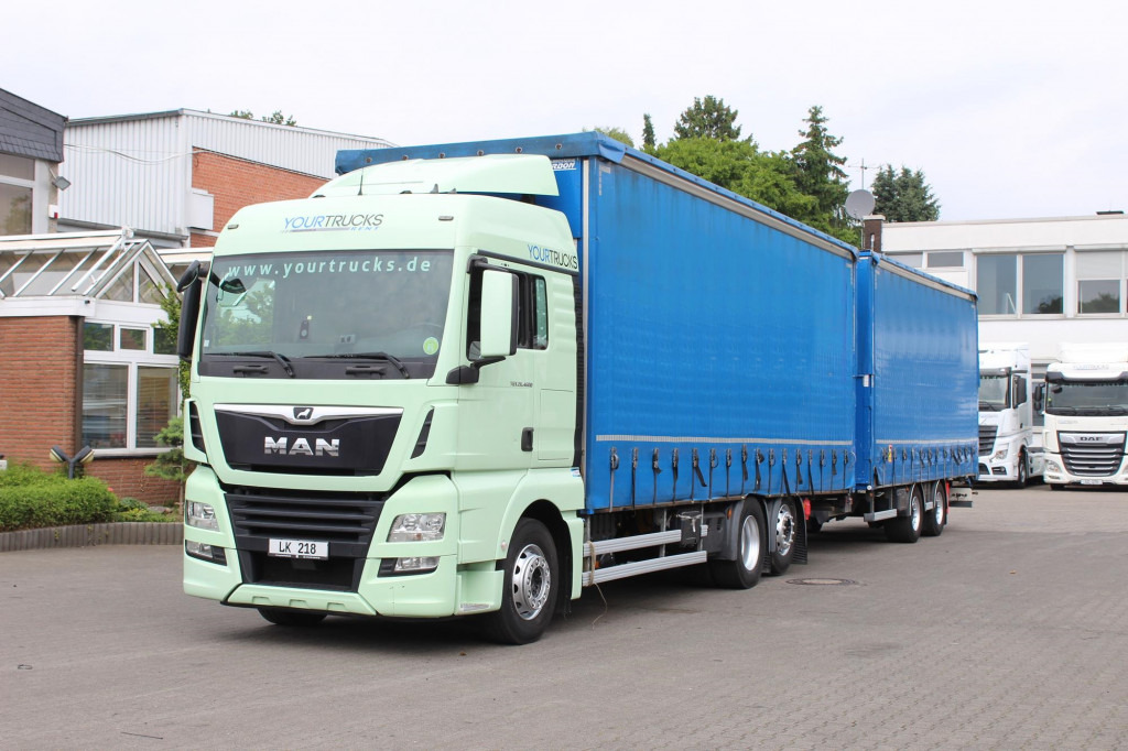 MAN TGX 26.460 Retarder Jumbo-Zug 120M3 Durchlade - Камион с брезент: снимка 1 MAN TGX 26.460 Retarder Jumbo-Zug 120M3 Durchlade - Камион с брезент: снимка 1