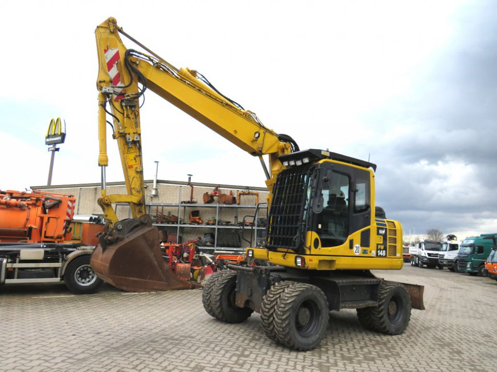 KOMATSU HANOMAG Mobilbagger PW 148 - 8 Bagger 6.824h Deutsch top - Колесен багер: снимка 1 KOMATSU HANOMAG Mobilbagger PW 148 - 8 Bagger 6.824h Deutsch top - Колесен багер: снимка 1