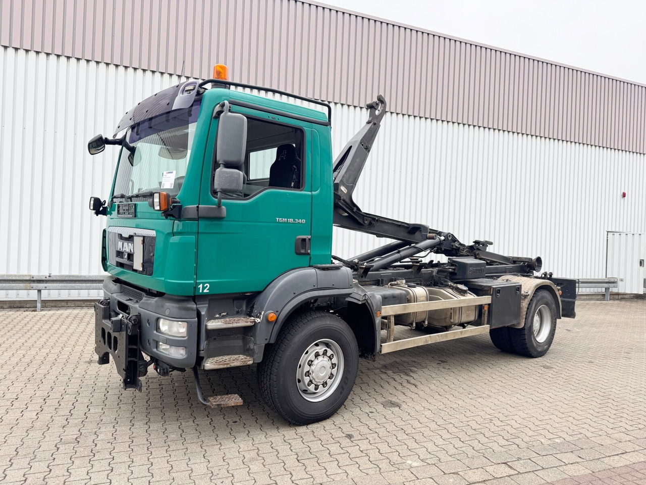 MAN TGM 18.340 4x4 BB TGM 18.340 4x4 BB, Hiab LHT 19046 Abrollkipper, Widi Platte - Мултилифт с кука камион: снимка 1 MAN TGM 18.340 4x4 BB TGM 18.340 4x4 BB, Hiab LHT 19046 Abrollkipper, Widi Platte - Мултилифт с кука камион: снимка 1