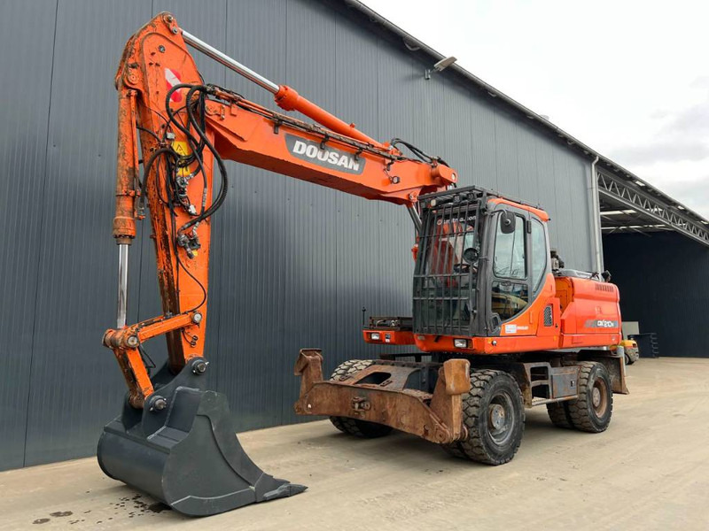 Doosan DX210W - Колесен багер: снимка 1 Doosan DX210W - Колесен багер: снимка 1