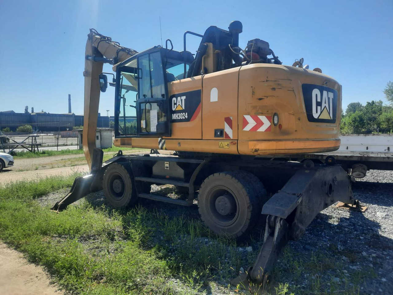 CAT MH3024-06 - Колесен багер: снимка 1 CAT MH3024-06 - Колесен багер: снимка 1