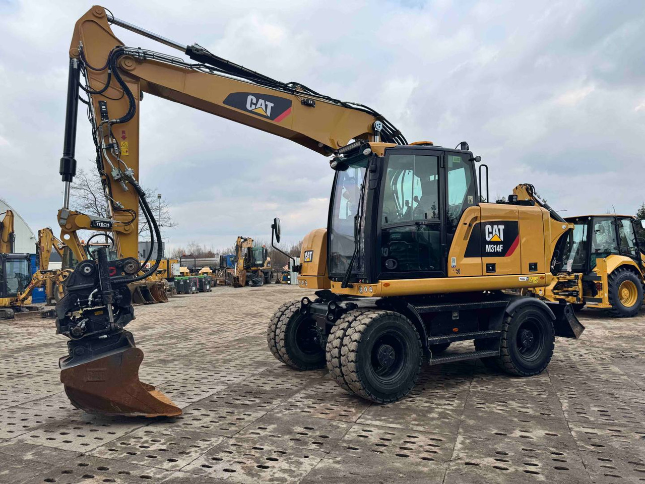 CAT M314F - Колесен багер: снимка 1 CAT M314F - Колесен багер: снимка 1