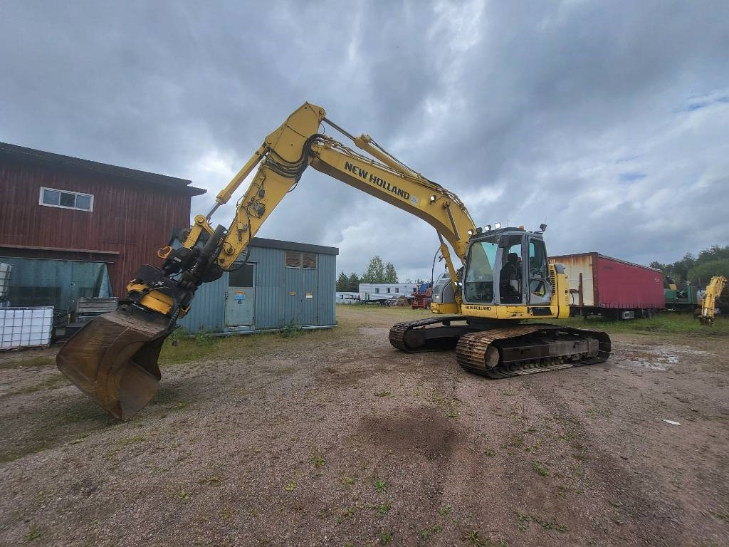 New Holland Kobelco E 235 B SR-2 - Верижен багер: снимка 1 New Holland Kobelco E 235 B SR-2 - Верижен багер: снимка 1