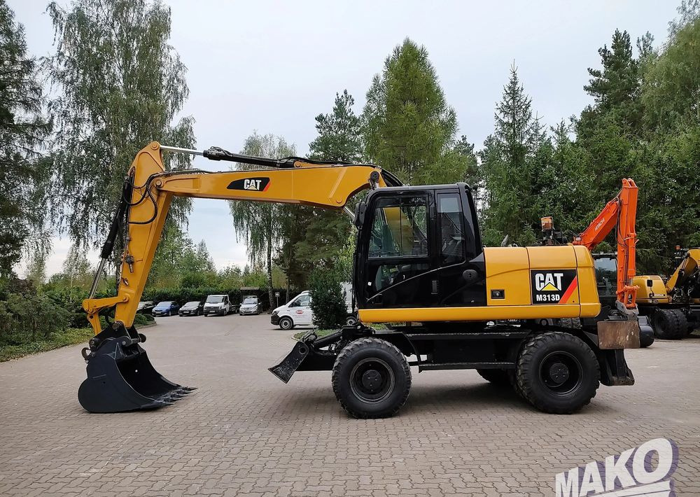 Caterpillar M313D - Колесен багер: снимка 1 Caterpillar M313D - Колесен багер: снимка 1