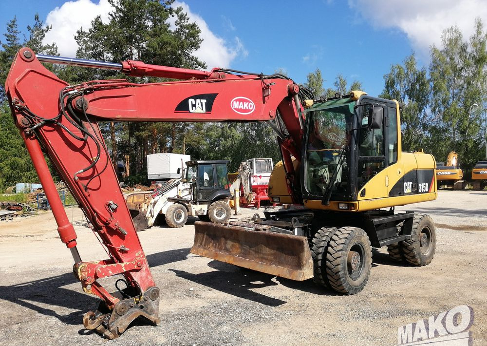 Caterpillar M315 C - Колесен багер: снимка 1 Caterpillar M315 C - Колесен багер: снимка 1