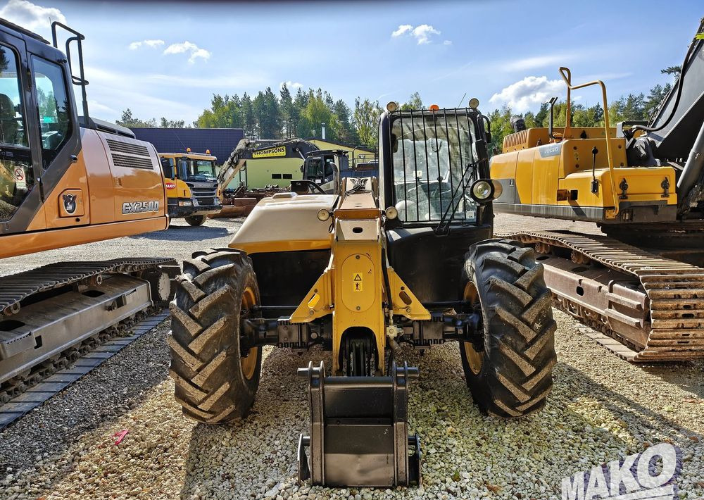 Телескопичен товарач Caterpillar TH407: снимка 7