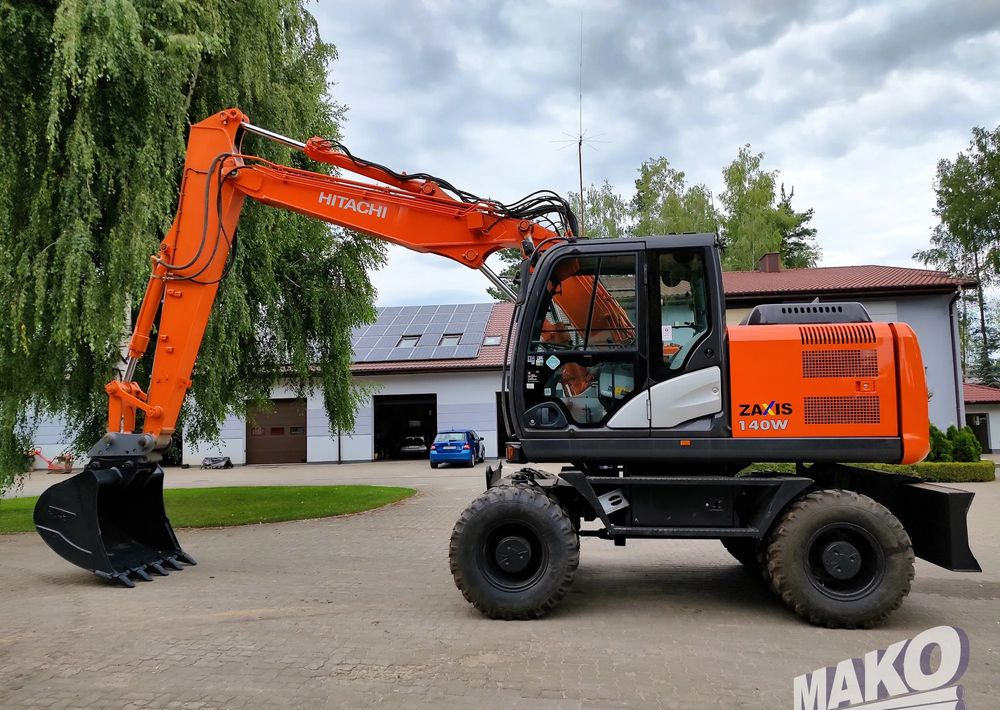 Hitachi ZX 140 - Колесен багер: снимка 1 Hitachi ZX 140 - Колесен багер: снимка 1