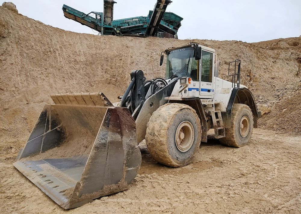 Volvo L180E - Колесен товарач: снимка 1 Volvo L180E - Колесен товарач: снимка 1