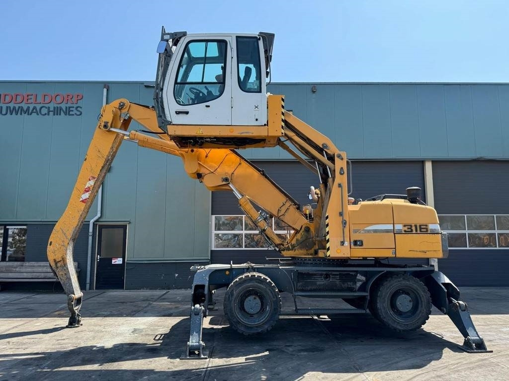 Liebherr A 316 - Багер за манипулиране на материали: снимка 1 Liebherr A 316 - Багер за манипулиране на материали: снимка 1