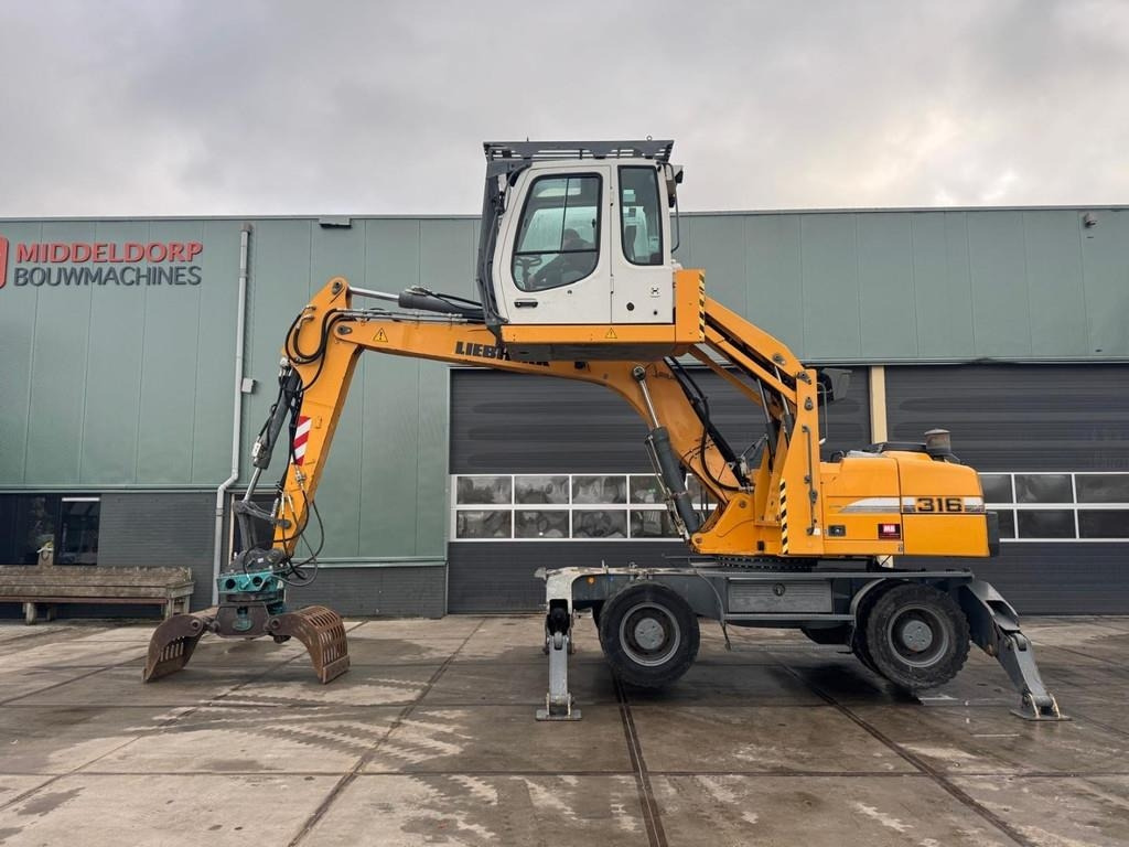 Liebherr A 316 - Багер за манипулиране на материали: снимка 1 Liebherr A 316 - Багер за манипулиране на материали: снимка 1