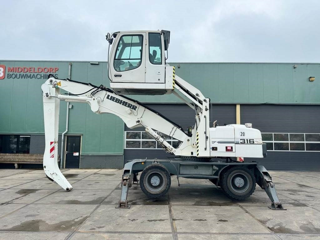 Liebherr A 316 - Багер за манипулиране на материали: снимка 1 Liebherr A 316 - Багер за манипулиране на материали: снимка 1