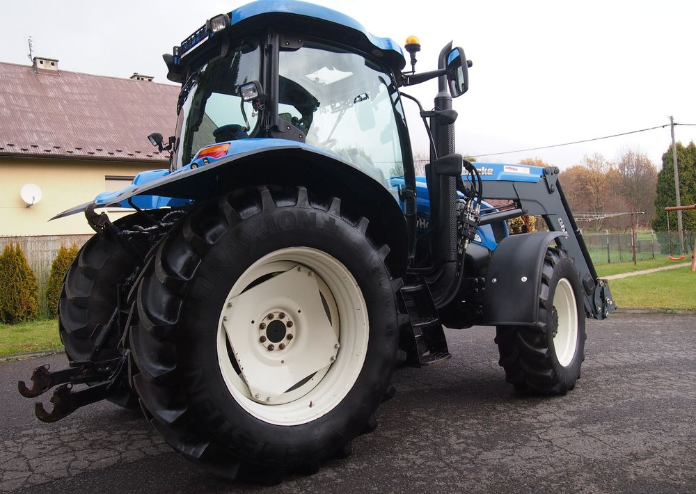 Ciągnik New Holland NH TS125A 6 cylindrów 2004 Ciągnik rolniczy New Holland TS125A - Трактор: снимка 4 Ciągnik New Holland NH TS125A 6 cylindrów 2004 Ciągnik rolniczy New Holland TS125A - Трактор: снимка 4