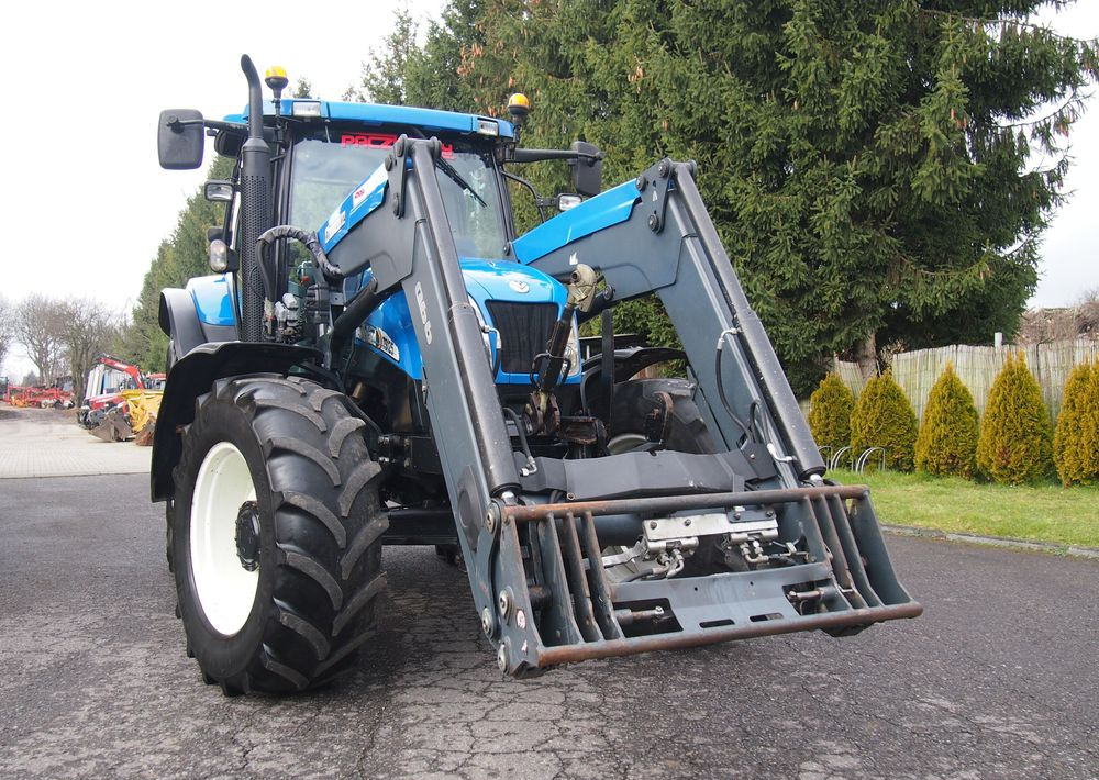 Трактор Ciągnik New Holland NH TS125A 6 cylindrów 2004 Ciągnik rolniczy New Holland TS125A: снимка 13 Трактор Ciągnik New Holland NH TS125A 6 cylindrów 2004 Ciągnik rolniczy New Holland TS125A: снимка 13