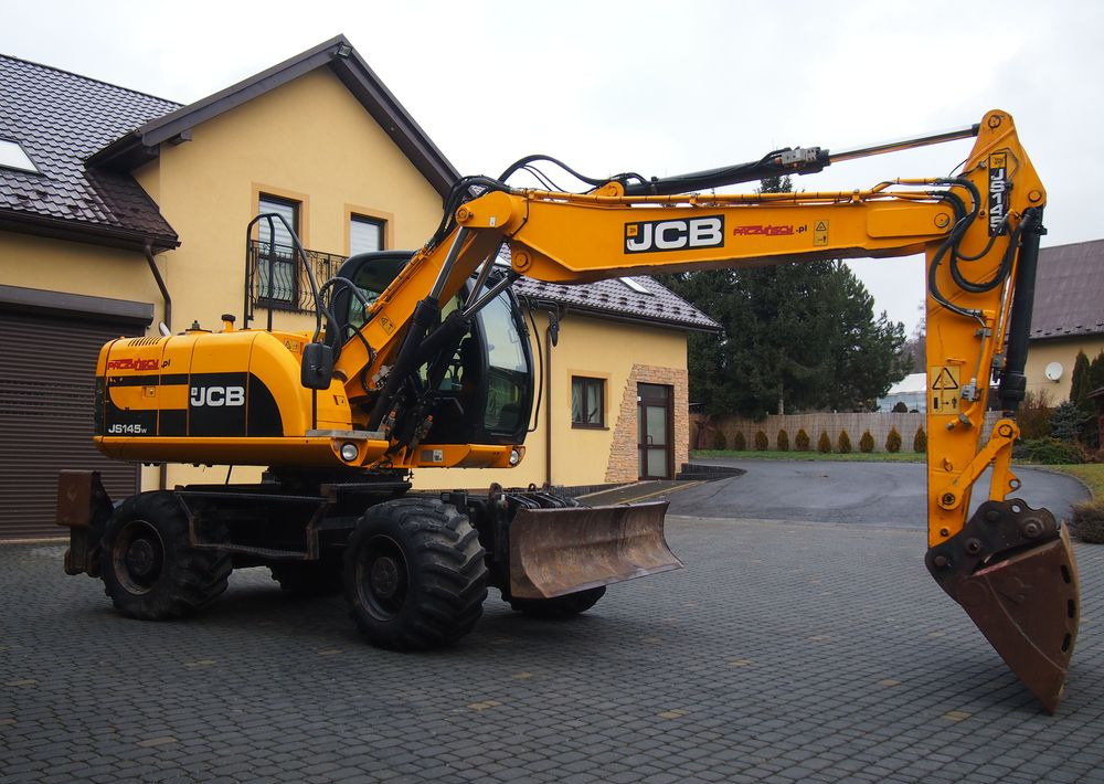 Koparka kołowa JCB JS145W 2011 Koparka JCB - Колесен багер: снимка 1 Koparka kołowa JCB JS145W 2011 Koparka JCB - Колесен багер: снимка 1
