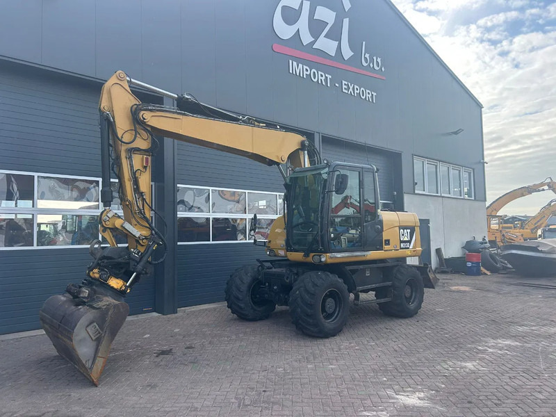 Caterpillar M313D - Колесен багер: снимка 1 Caterpillar M313D - Колесен багер: снимка 1