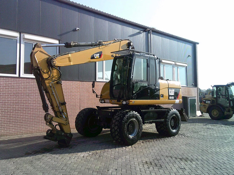 Caterpillar M315D - Колесен багер: снимка 1 Caterpillar M315D - Колесен багер: снимка 1