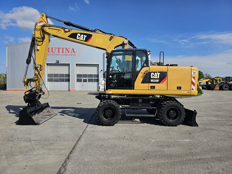 CATERPILLAR M320F - Колесен багер: снимка 1 CATERPILLAR M320F - Колесен багер: снимка 1