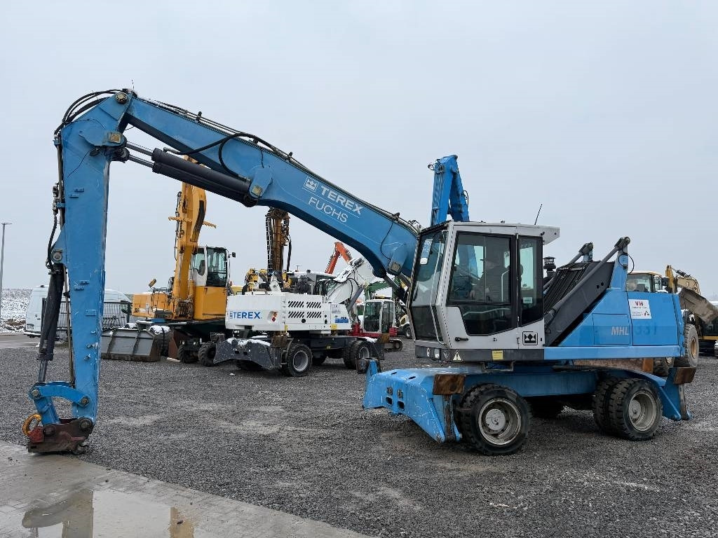Fuchs MHL 331 - Багер за манипулиране на материали: снимка 1 Fuchs MHL 331 - Багер за манипулиране на материали: снимка 1