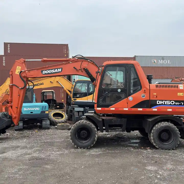Used Doosan Dh150W-7 Medium 15 Ton Second-Hand Construction Machinery Doosan 60W/150W/210W in Stock - Багер: снимка 1 Used Doosan Dh150W-7 Medium 15 Ton Second-Hand Construction Machinery Doosan 60W/150W/210W in Stock - Багер: снимка 1