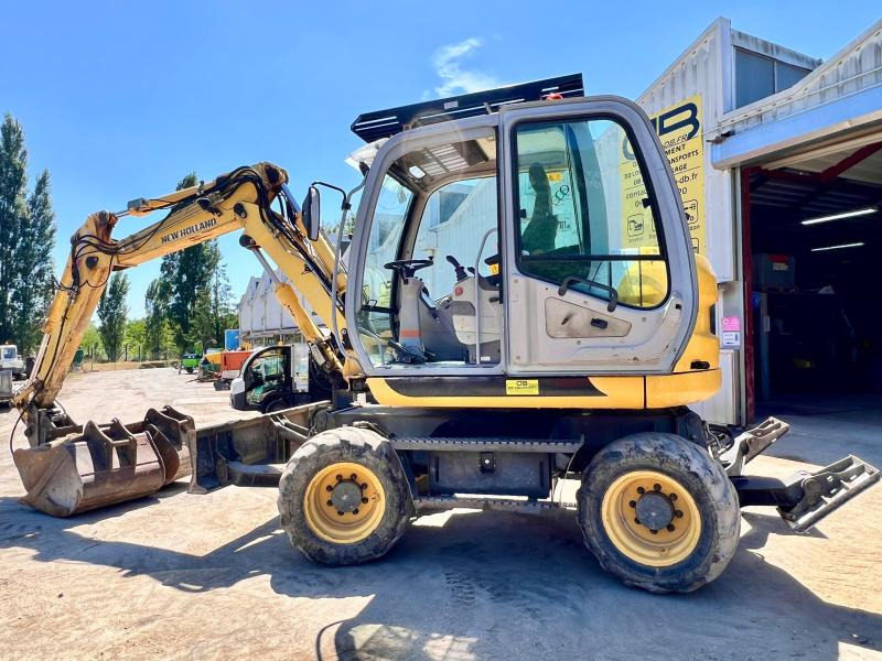 New Holland MH 2.6 PELLE A PNEUS 10T - Колесен багер: снимка 2 New Holland MH 2.6 PELLE A PNEUS 10T - Колесен багер: снимка 2