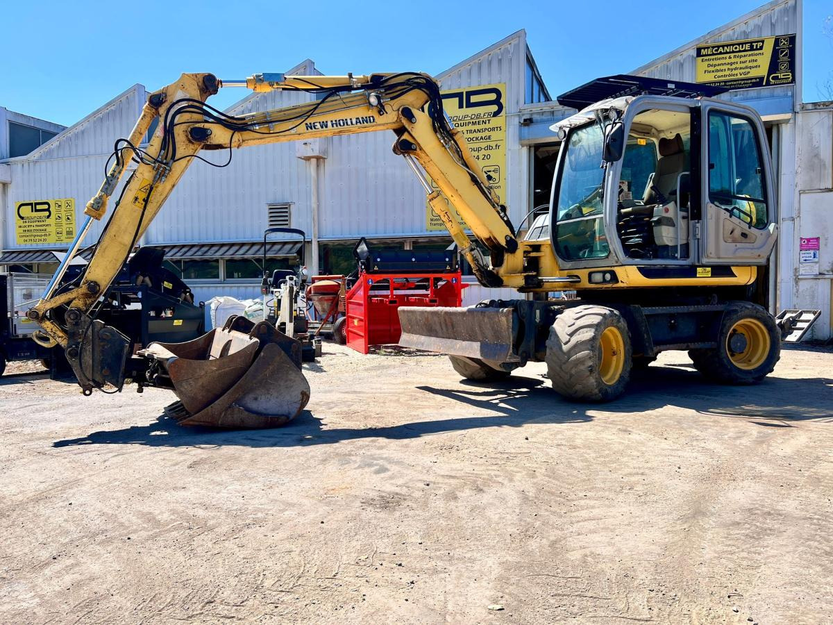New Holland MH 2.6 PELLE A PNEUS 10T - Колесен багер: снимка 1 New Holland MH 2.6 PELLE A PNEUS 10T - Колесен багер: снимка 1