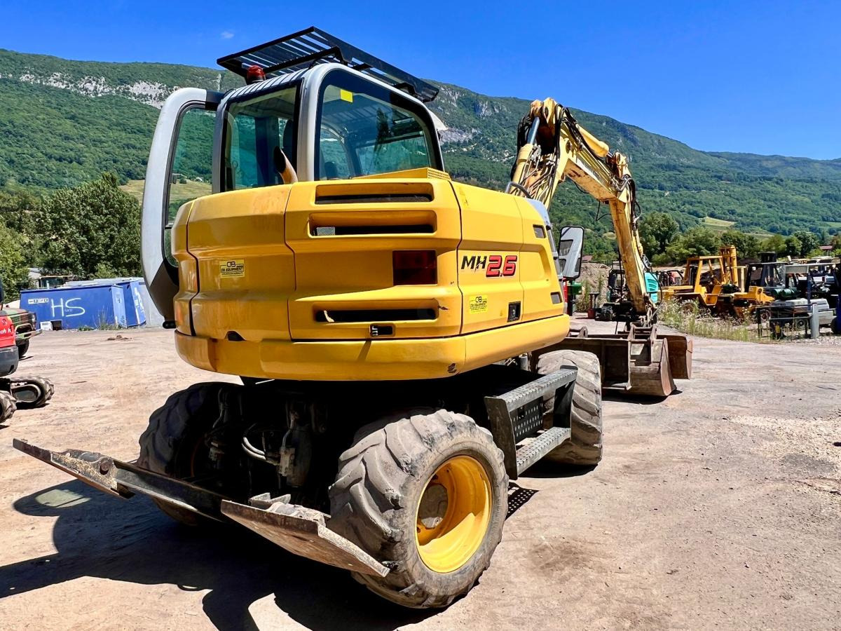 New Holland MH 2.6 PELLE A PNEUS 10T - Колесен багер: снимка 4 New Holland MH 2.6 PELLE A PNEUS 10T - Колесен багер: снимка 4