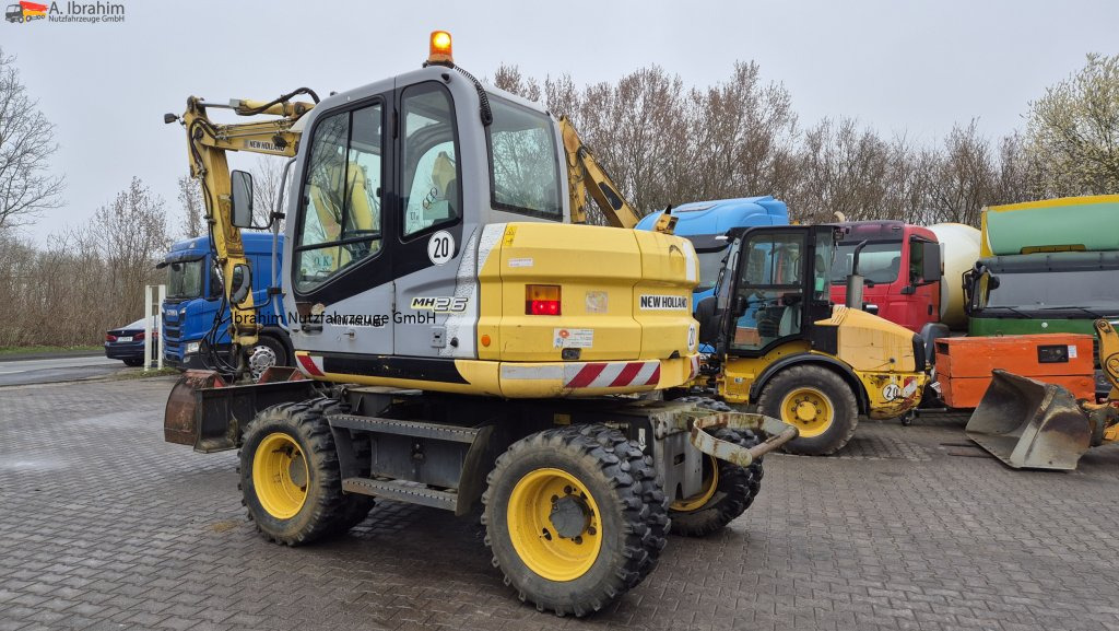 Колесен багер New Holland MH 2.6 Zustand gut, deutsche Maschine incl. Greifer und Dreservo: снимка 10