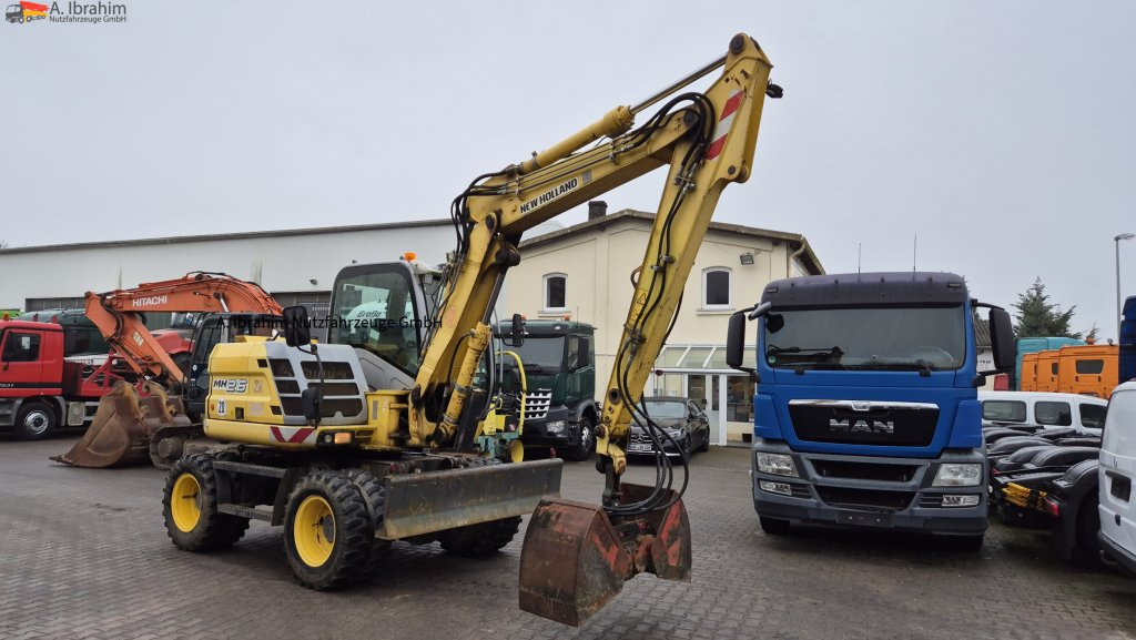 Колесен багер New Holland MH 2.6 Zustand gut, deutsche Maschine incl. Greifer und Dreservo: снимка 6