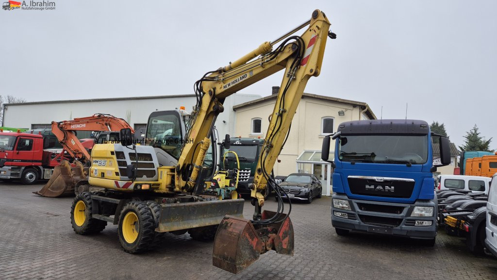Колесен багер New Holland MH 2.6 Zustand gut, deutsche Maschine incl. Greifer und Dreservo: снимка 9