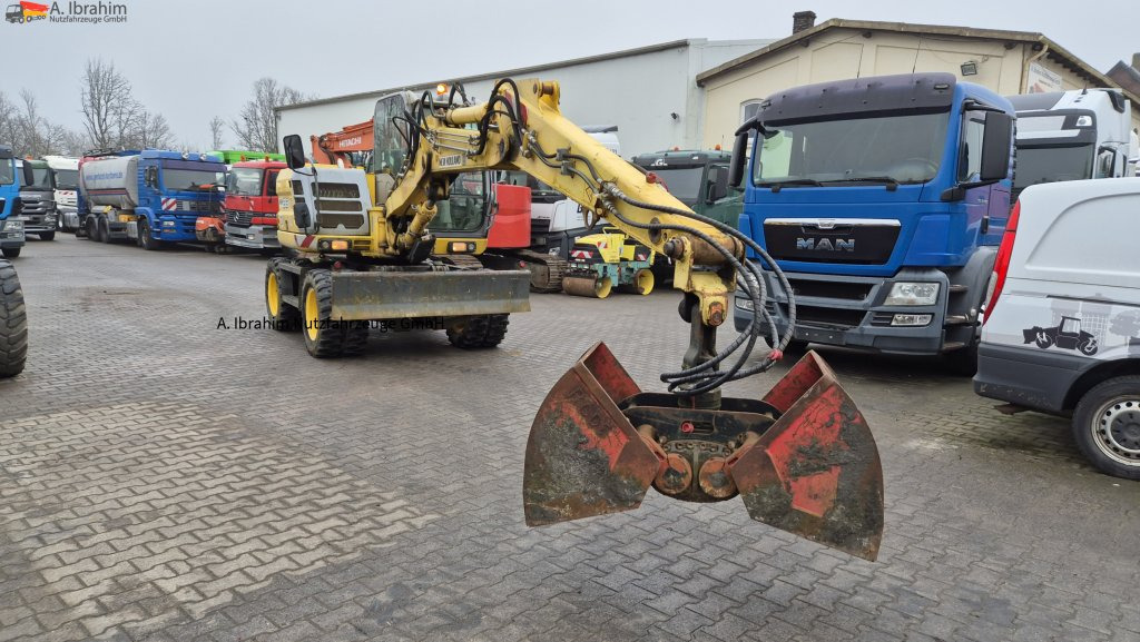 Колесен багер New Holland MH 2.6 Zustand gut, deutsche Maschine incl. Greifer und Dreservo: снимка 13