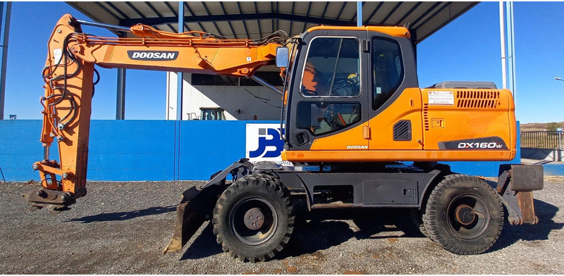Doosan DX140W-3 - Колесен багер: снимка 1 Doosan DX140W-3 - Колесен багер: снимка 1