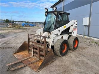 Bobcat A 220 - Мини челен товарач: снимка 1 Bobcat A 220 - Мини челен товарач: снимка 1