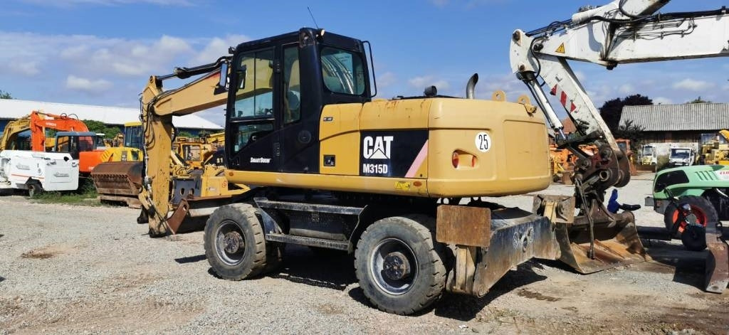 CAT M 315 D - Колесен багер: снимка 5 CAT M 315 D - Колесен багер: снимка 5