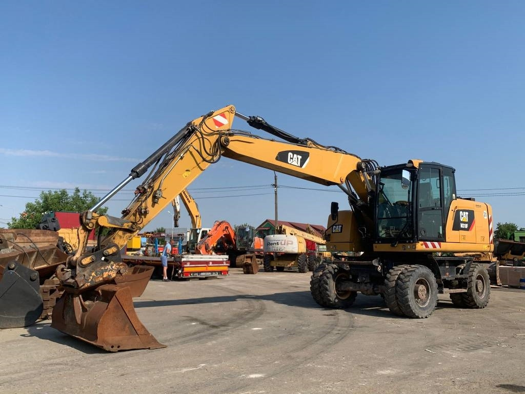 CAT M 318 F - Колесен багер: снимка 1 CAT M 318 F - Колесен багер: снимка 1